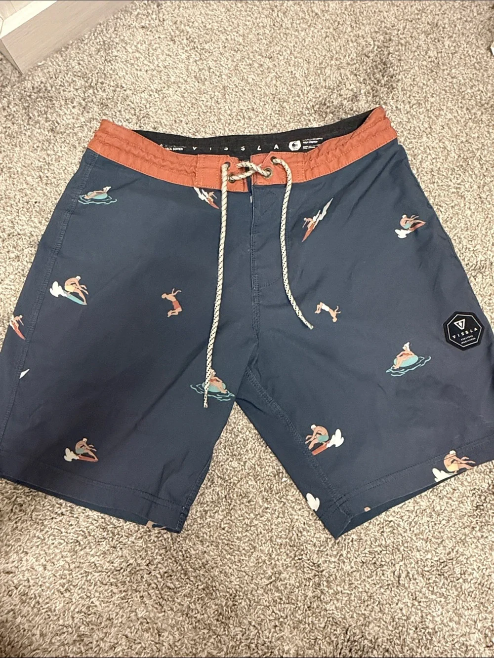 VISSLA Navy Swim Shorts with Rust Waistband and Surf Print